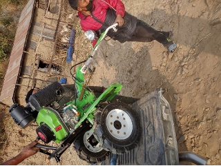 A man operating a tractor.