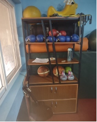 Sports equipment showcased in a cabinet.